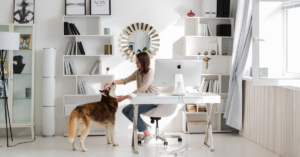 Lady working at home with her dog