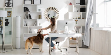 Lady working at home with her dog