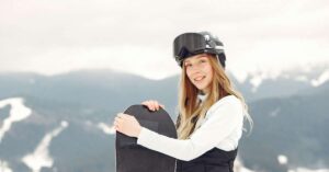 Young woman with snowboard